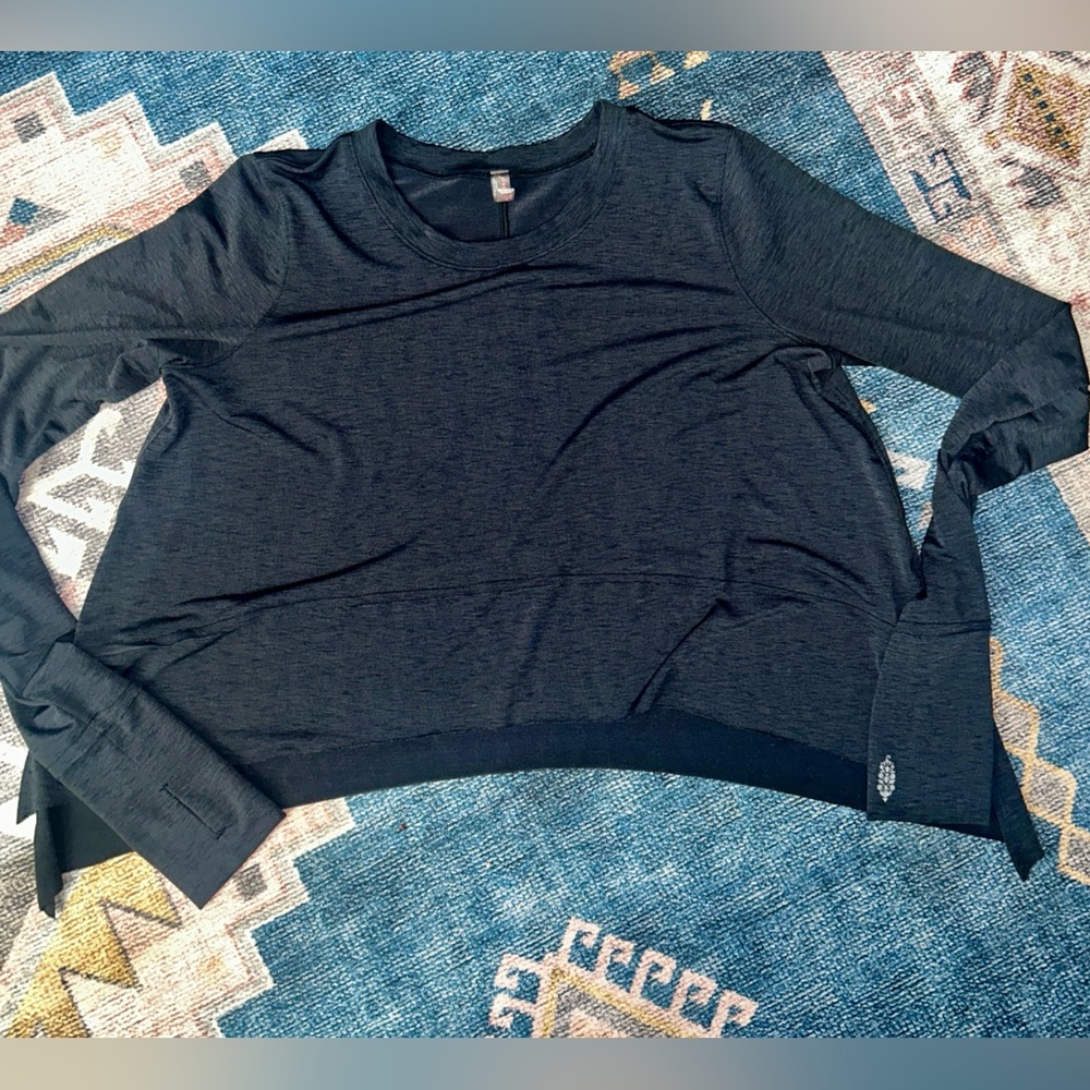 Like new, free people movement, long sleeve top with thumb holes.